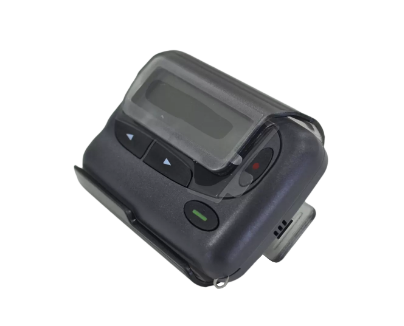 A black CST 2028 pager with a digital display and multiple function buttons.