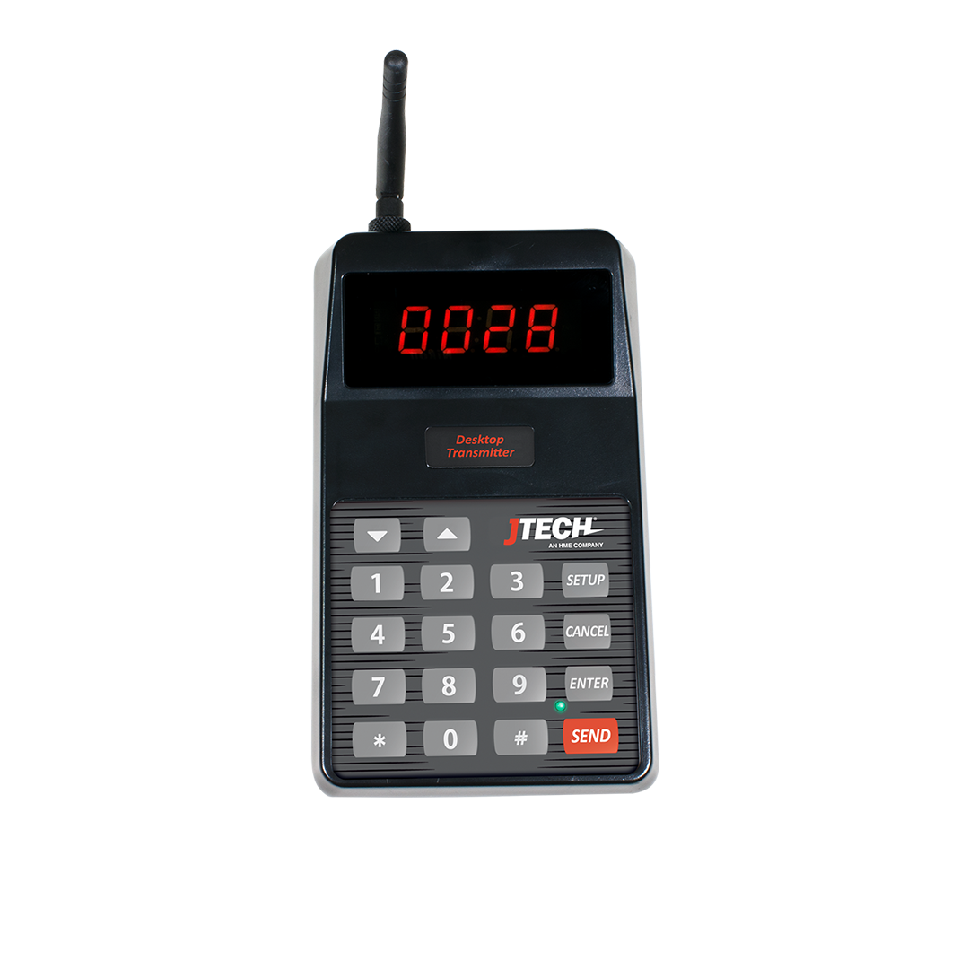 A JTECH desktop transmitter witha keyboard and a digital display.